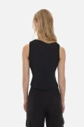 Back view of a person wearing a black sleeveless top and black cargo pants, standing against a light background